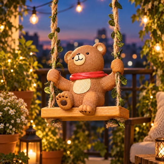 Swinging Bear Garden Décor in an evening balcony setting