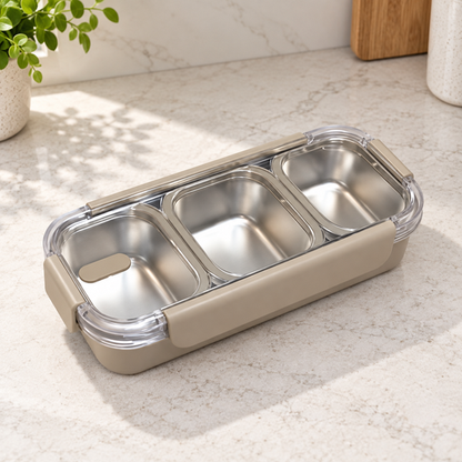 Open empty three-compartment stainless steel lunch box