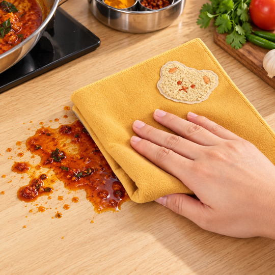 Cleaning cloth wiping a kitchen spill