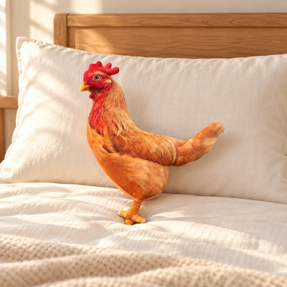 Hen Plush Pillow on a bed
