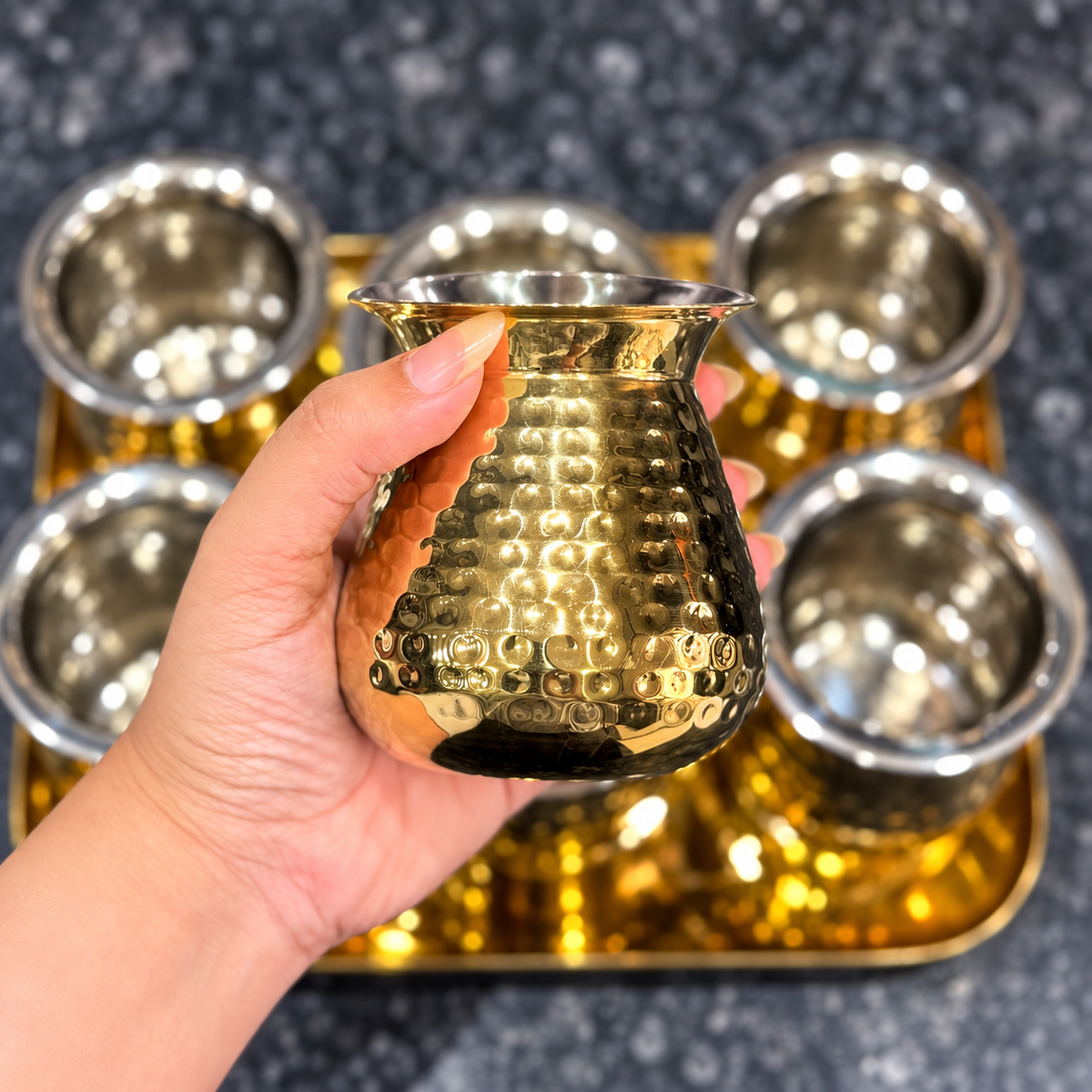 Royal Lota glass shown in hand for scale