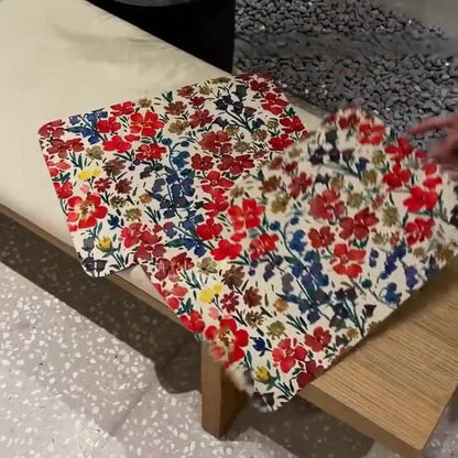 Floral table mats arranged on a dining table