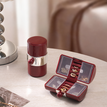 Wine-red Mini Jewelry Travel Case open and closed on a table