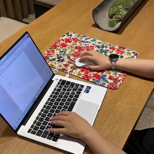 Floral table mat used in a workspace