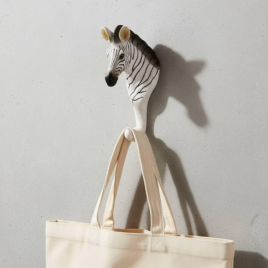 Zebra animal wall hook holding a tote bag