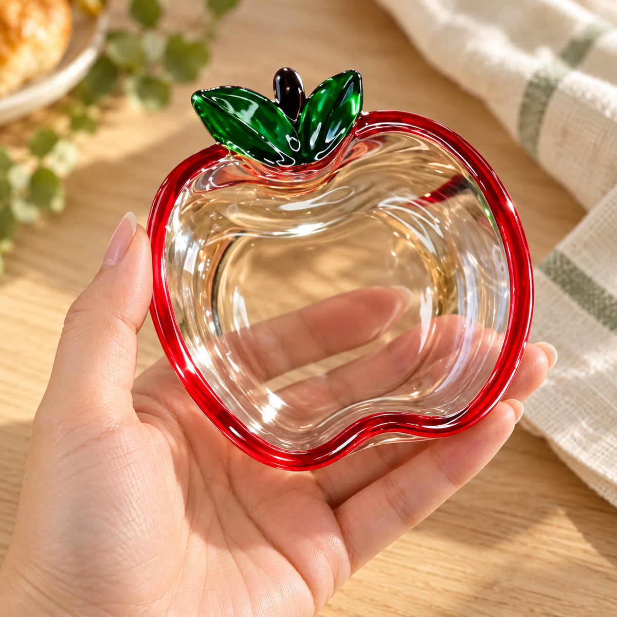 Apple glass dish held in a hand