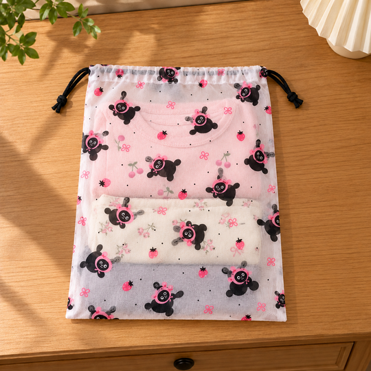 CozyNest drawstring bag with folded clothes inside