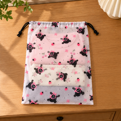 CozyNest drawstring bag with folded clothes inside