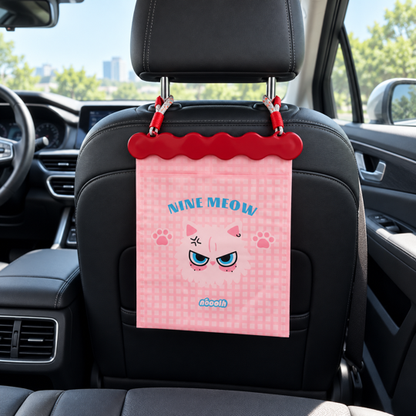 Pink cat Hanging Car Seat Trash Bag installed behind headrest