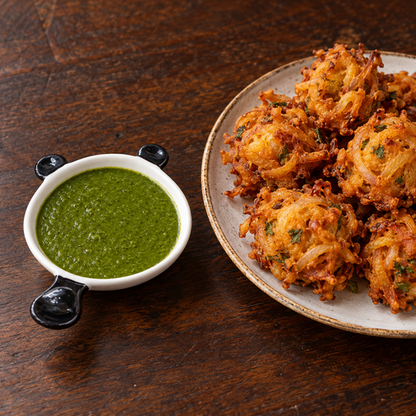 Panda Dip Bowl with chutney beside onion bhaji
