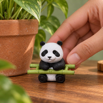 PandaPatch Planter Decor — miniature panda held beside a plant