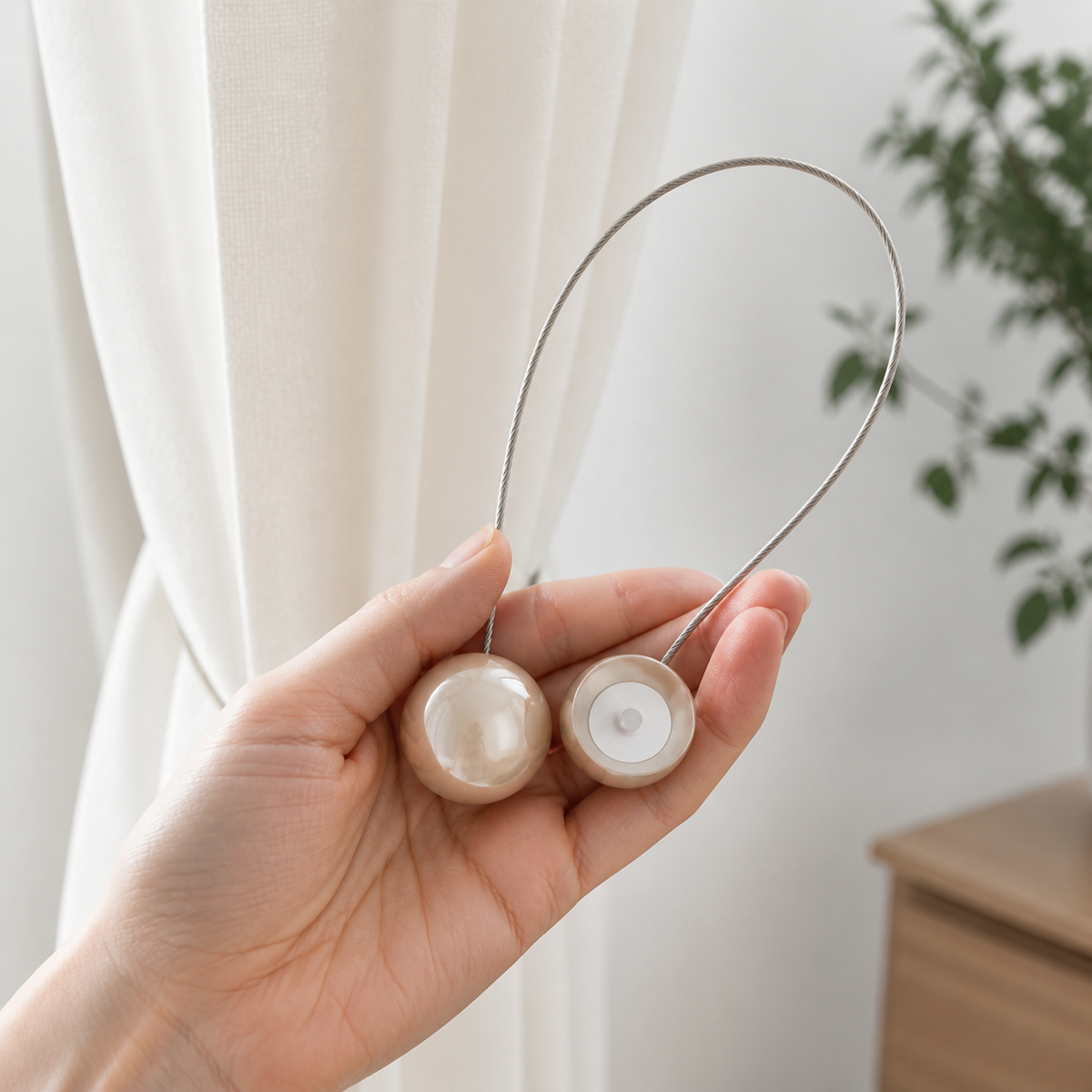 Flexible braided loop and magnetic pearl clasp held in hand
