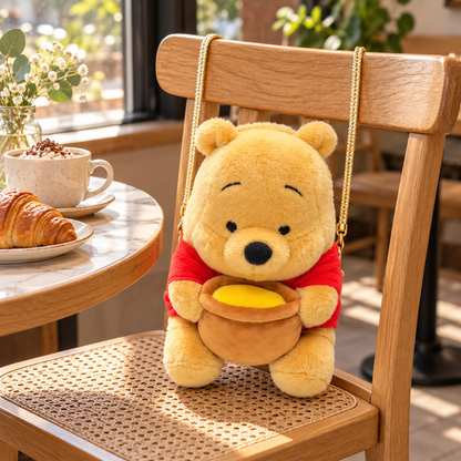 Pooh Sling Bag displayed on a cafe chair