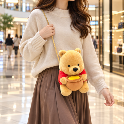 Pooh Sling Bag styled with a gold chain in a mall