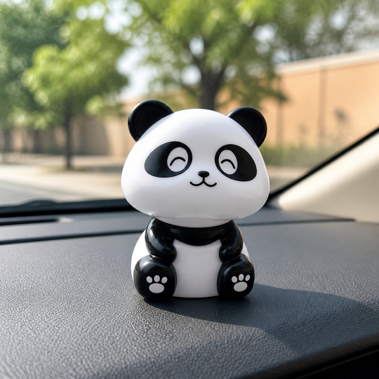 Solar Dancing Panda Toy on a car dashboard