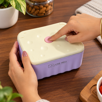 Hand pressing Stack Mate lunch box lid button