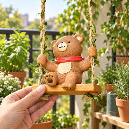 Swinging Bear Garden Décor shown in hand for scale
